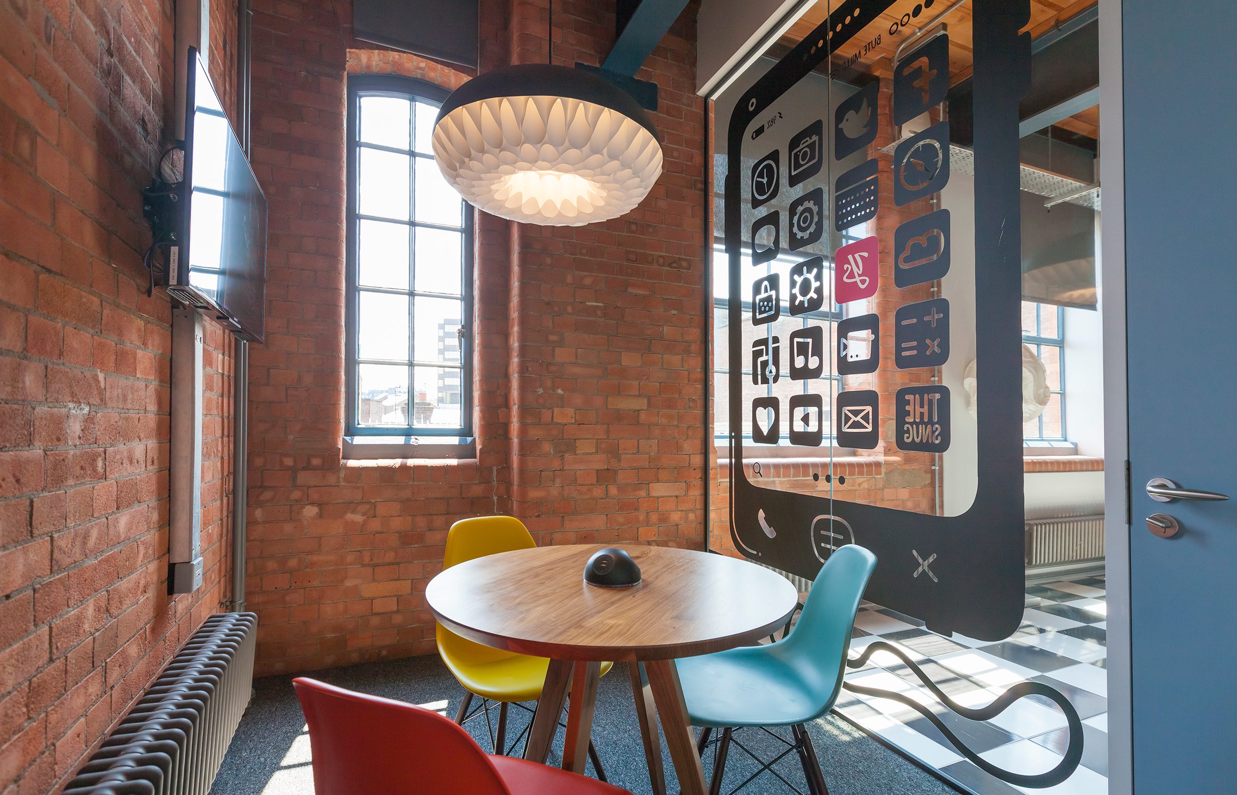 The snug is a bright room, with a beautiful glass wall.