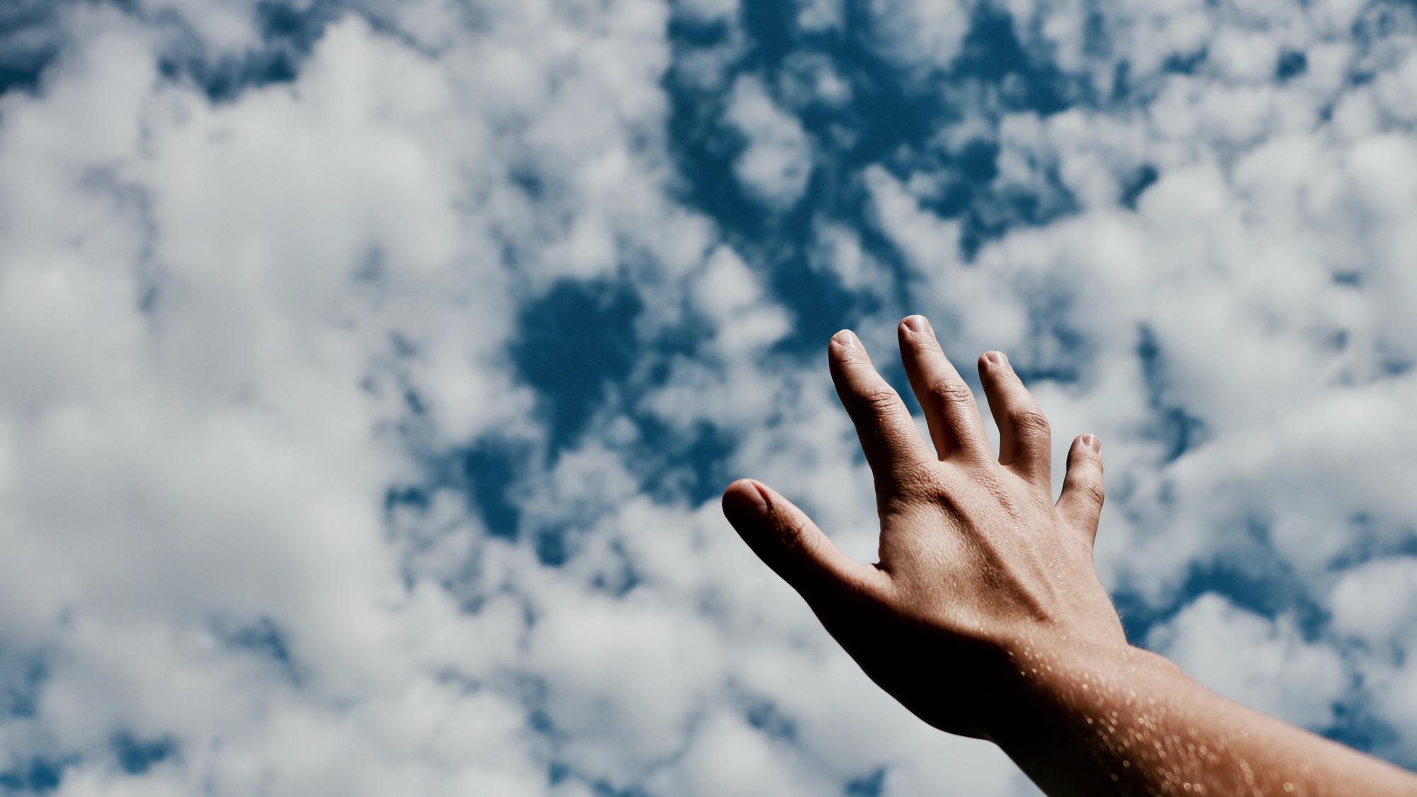 worship-hand-blue-sky