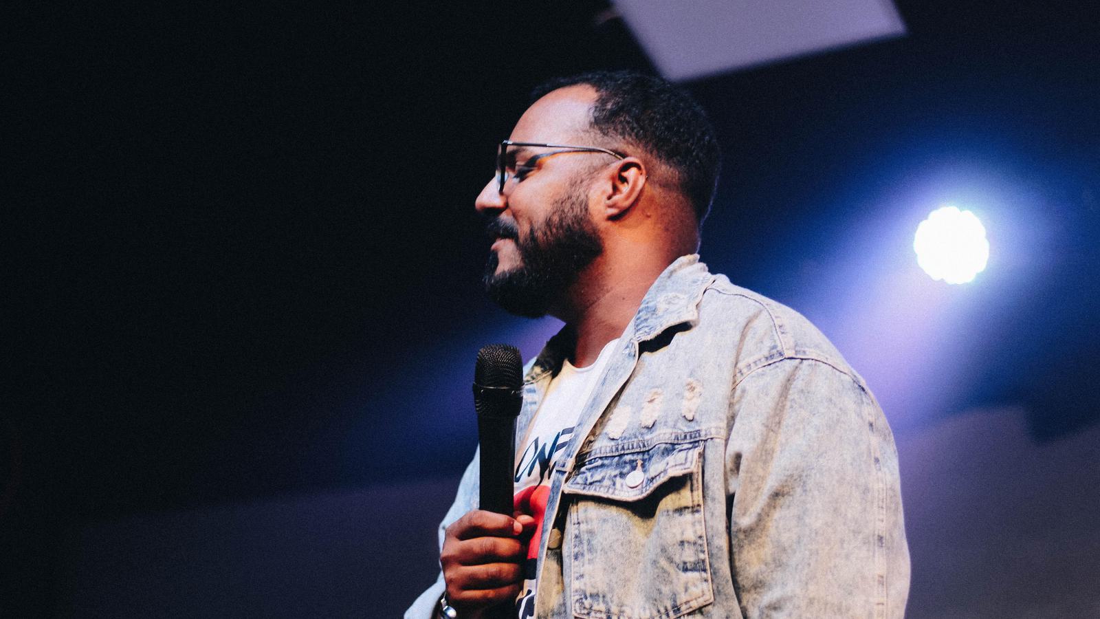 man speaking on stage